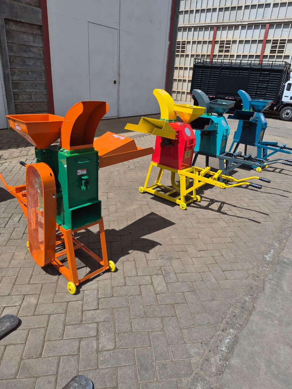 Chaff cutters and posho mills lined up in the yard